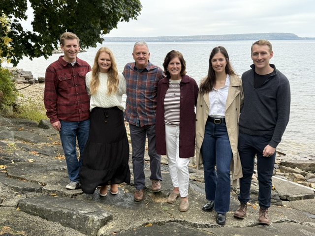 David and Joleen De La Hunt with family by a lake